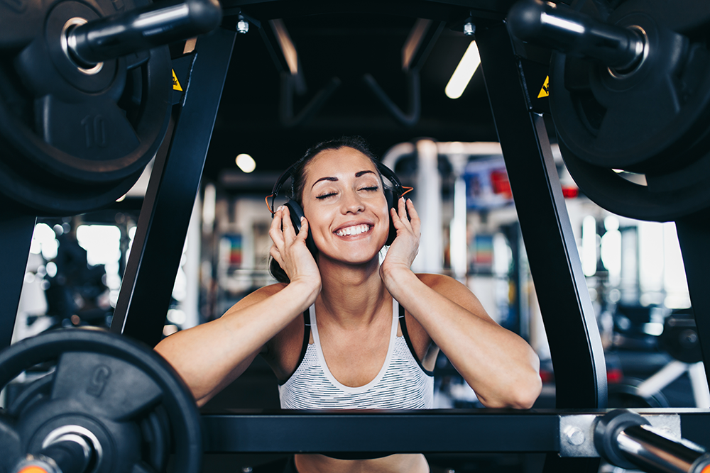 woman making fitness fun by listening to music