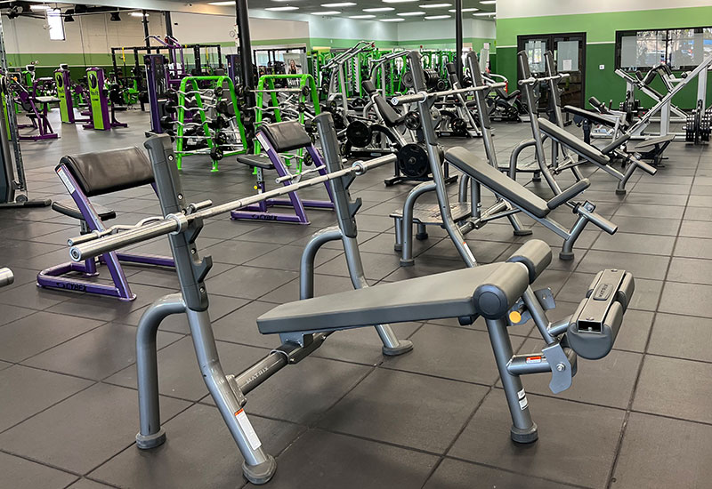 Bench press area with incline and decline benches at the YouFit Sarasota gym