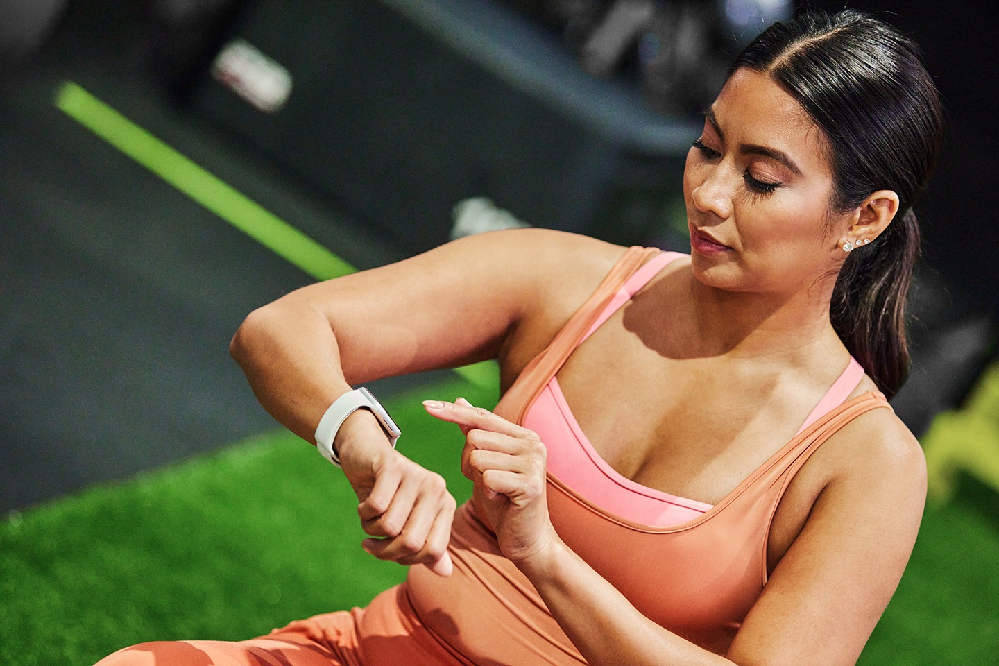 woman checking fitness tracker